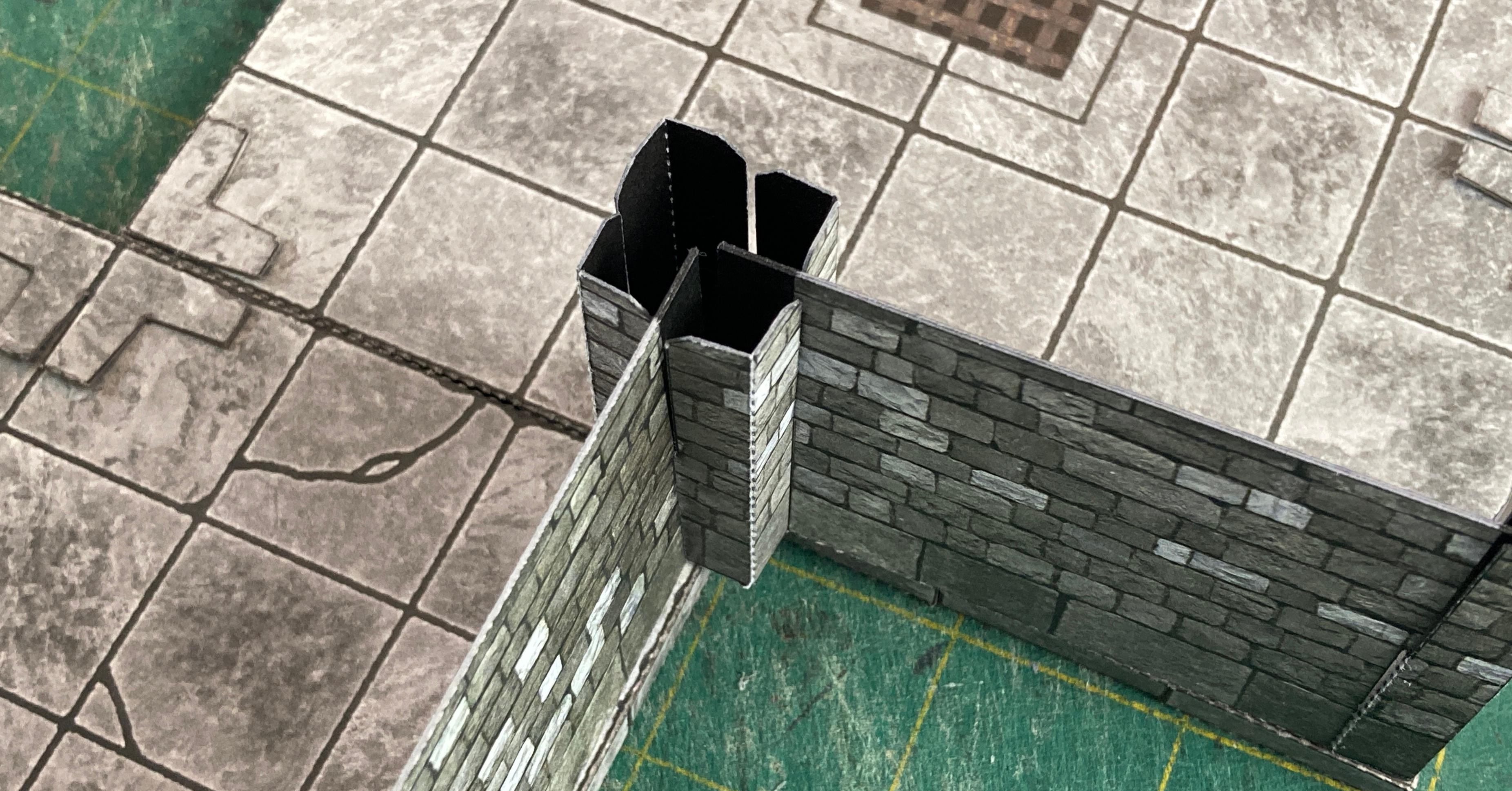 A center post overhangs the tiles because it is meant to cover four tile tabs.